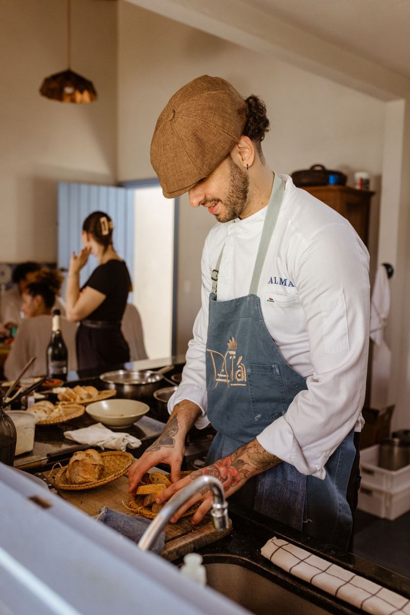 Chef cooking in a small restaurant kitchen